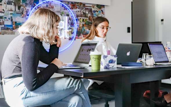 Team members working together to solve problems